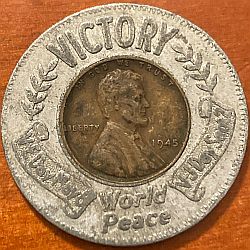 Victory Encased Obverse type 1 with scrolls and laurel - Victory at top World Peace at bottom - V-E Day May 8 at left V-J Day Sept 2 on right